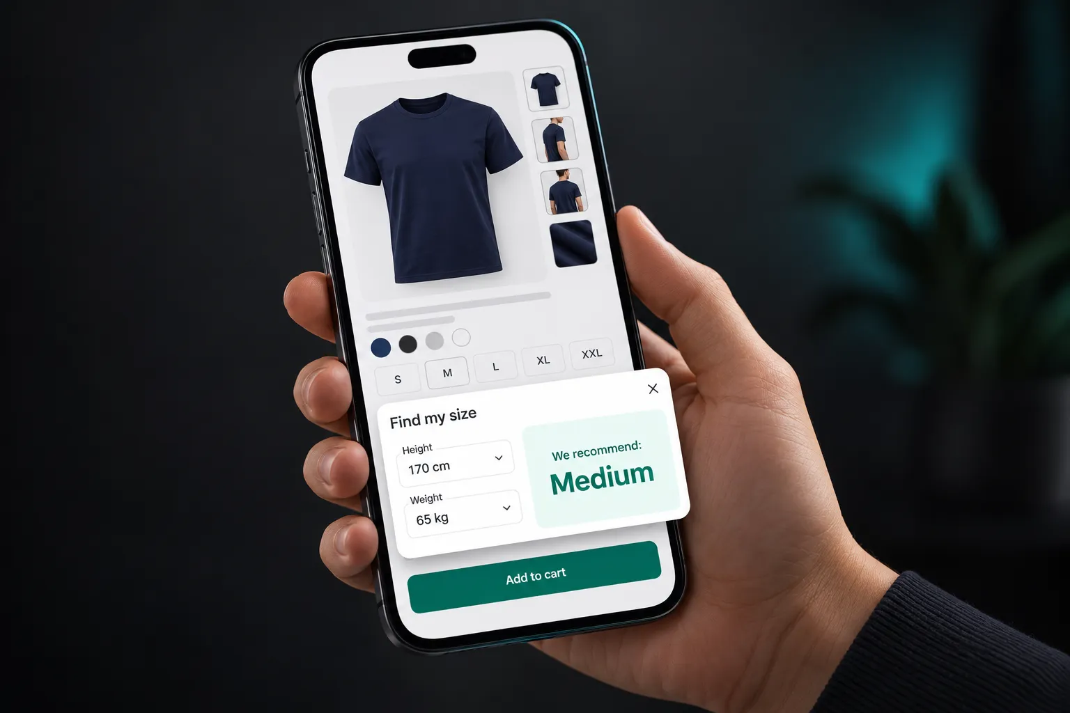 Shopper holding a phone on a Shopify product page for a navy t-shirt, with the Find my size panel recommending Medium